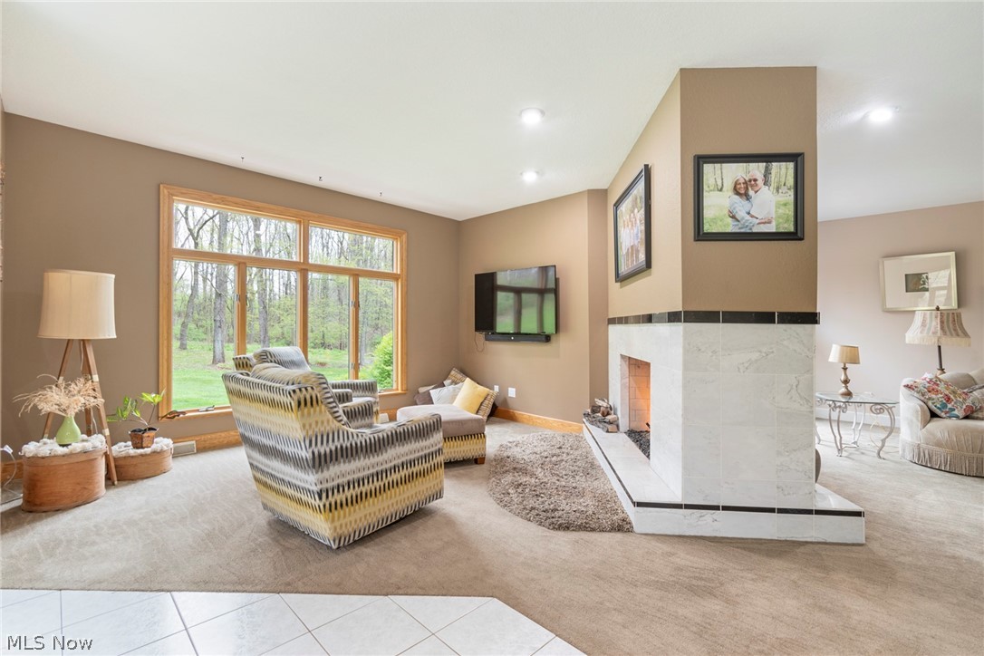 7435 South Raccoon Road Canfield, OH 44406 - Photo 19 of 47 Living room featuring light tile flooring and a premium fireplace