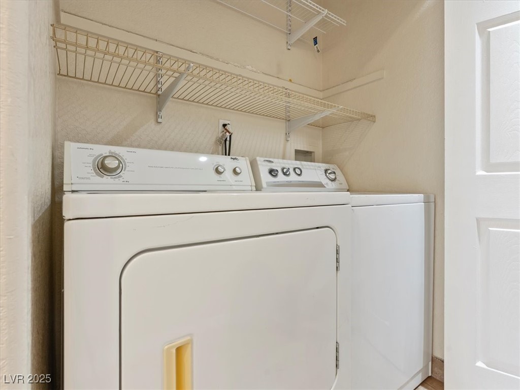 5052 South Rainbow Boulevard, Unit 201 Las Vegas, NV 89118 - Photo 15 of 24 Laundry area featuring washing machine and clothes dryer