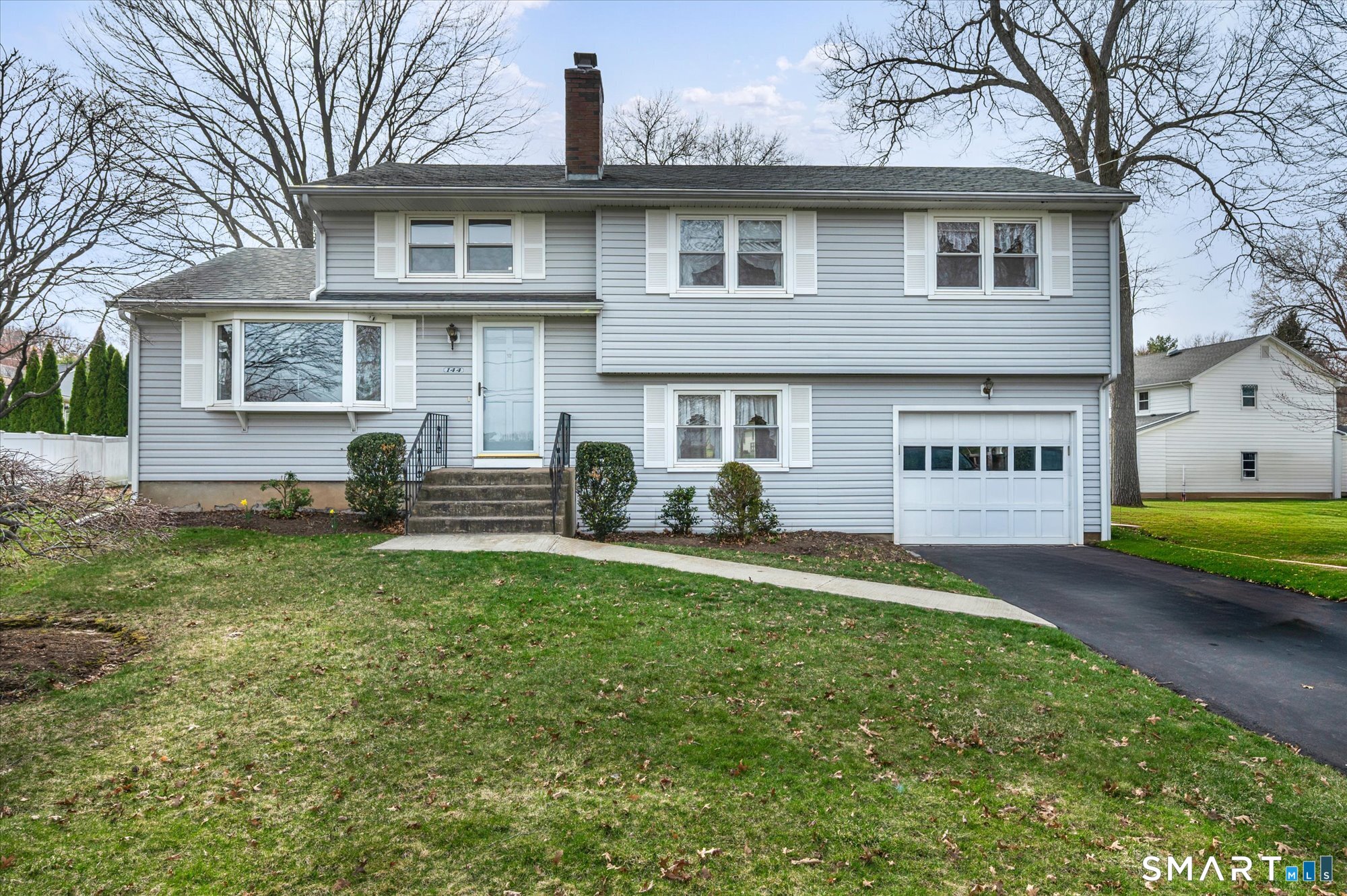 144 Brown Street Wethersfield, CT 06109 - Photo 1 of 1 a view of a house with a yard