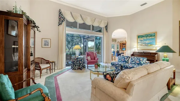 a kitchen with stainless steel appliances kitchen island granite countertop a refrigerator and a sink