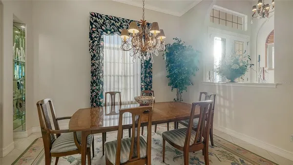 a living room with furniture a table and chairs