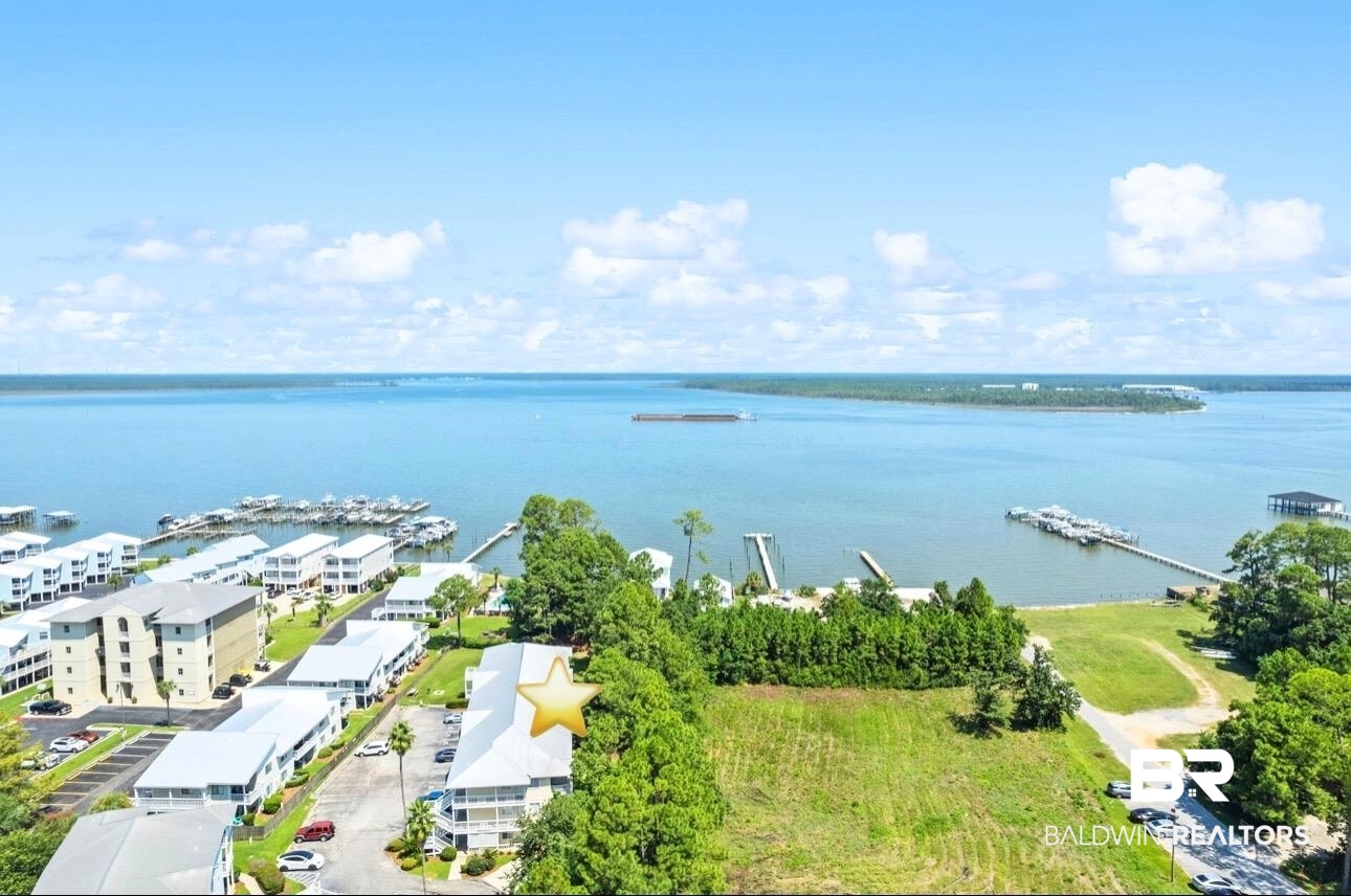 25957 Canal Road, Unit 302 Orange Beach, AL 36561 - Photo 1 of 26 Drone / aerial view with a water view