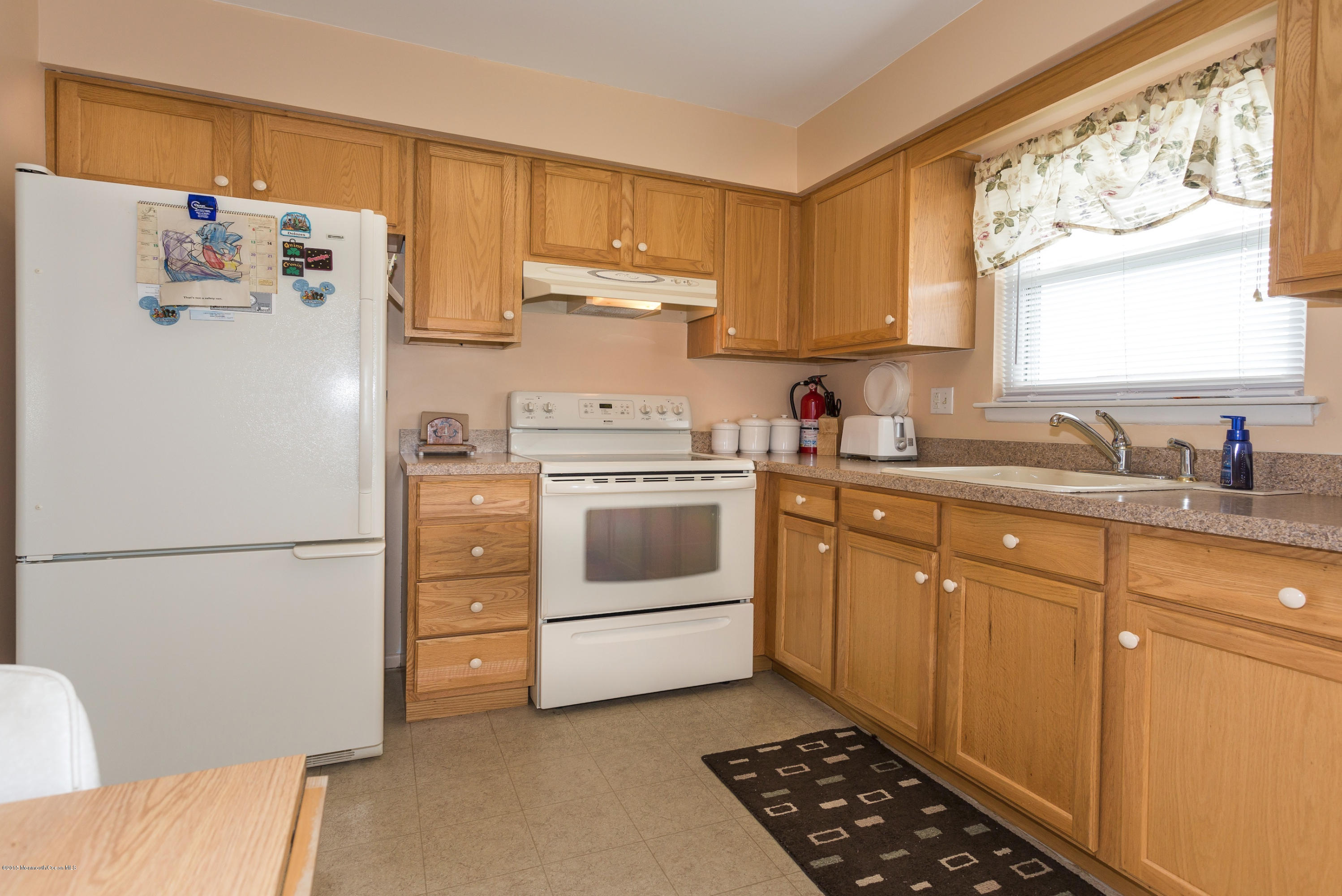 4 Masters Road Brick, NJ 08724 - Photo 4 of 16 a white kitchen with a refrigerator sink and cabinets