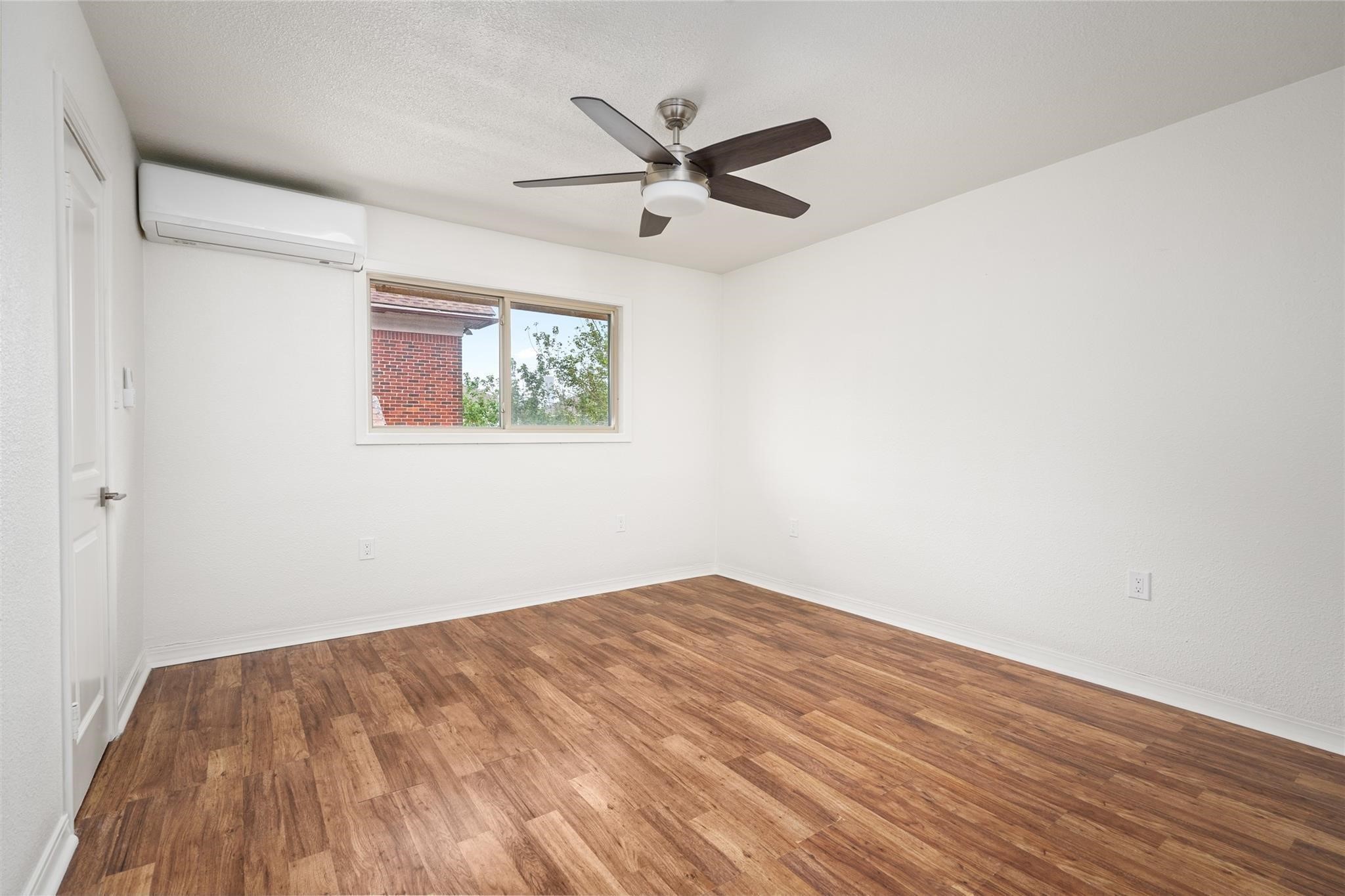 3910 Dallas Street, Unit 3 Houston, TX 77023 - Photo 4 of 8 a view of empty room with wooden floor