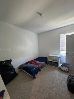 a bathroom with a double vanity sink mirror and bathtub