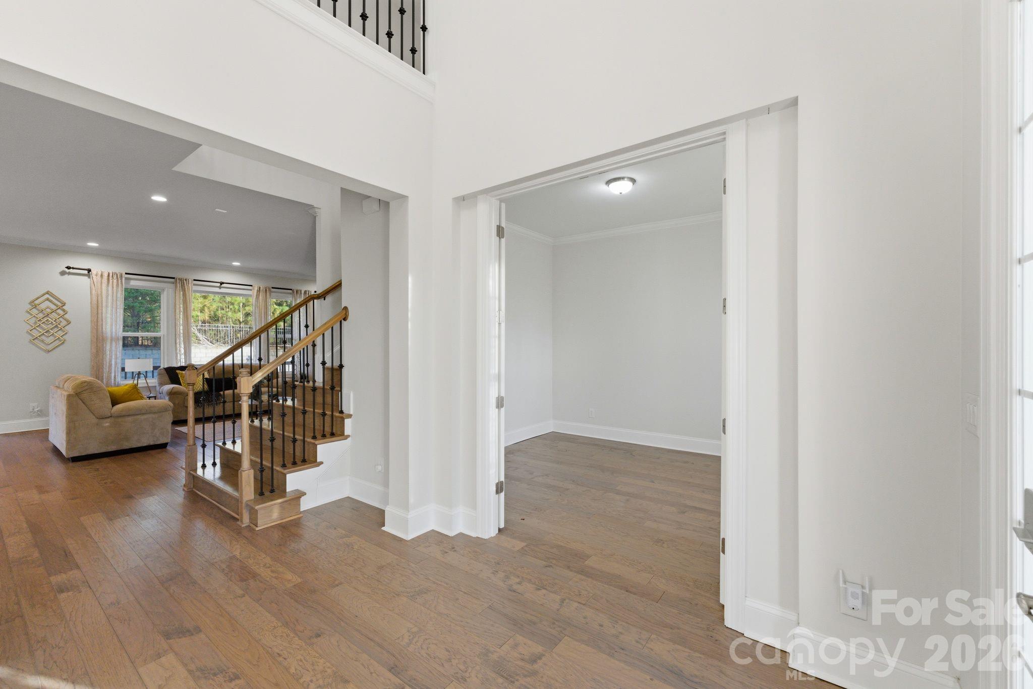 374 Hampton Trail Drive Fort Mill, SC 29708 - Photo 10 of 46 a view of entryway with stairs and wooden floor
