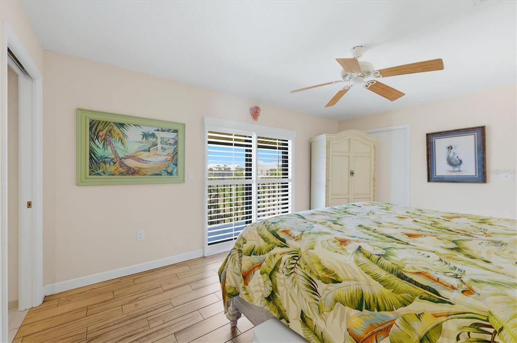 2729 North Beach Road, Unit 211 Englewood, FL 34223 - Photo 26 of 51 a bedroom with a bed and a window