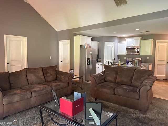 335 Stanebrook Court Jackson, GA 30233 - Photo 2 of 3 a living room with furniture and a couch