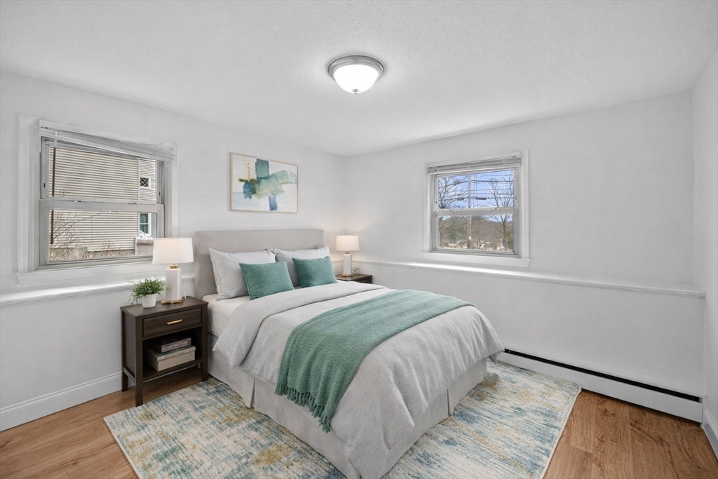 121 Cambridge Road, Unit 2 Woburn, MA 01801 - Photo 16 of 23 a bedroom with a bed and a window