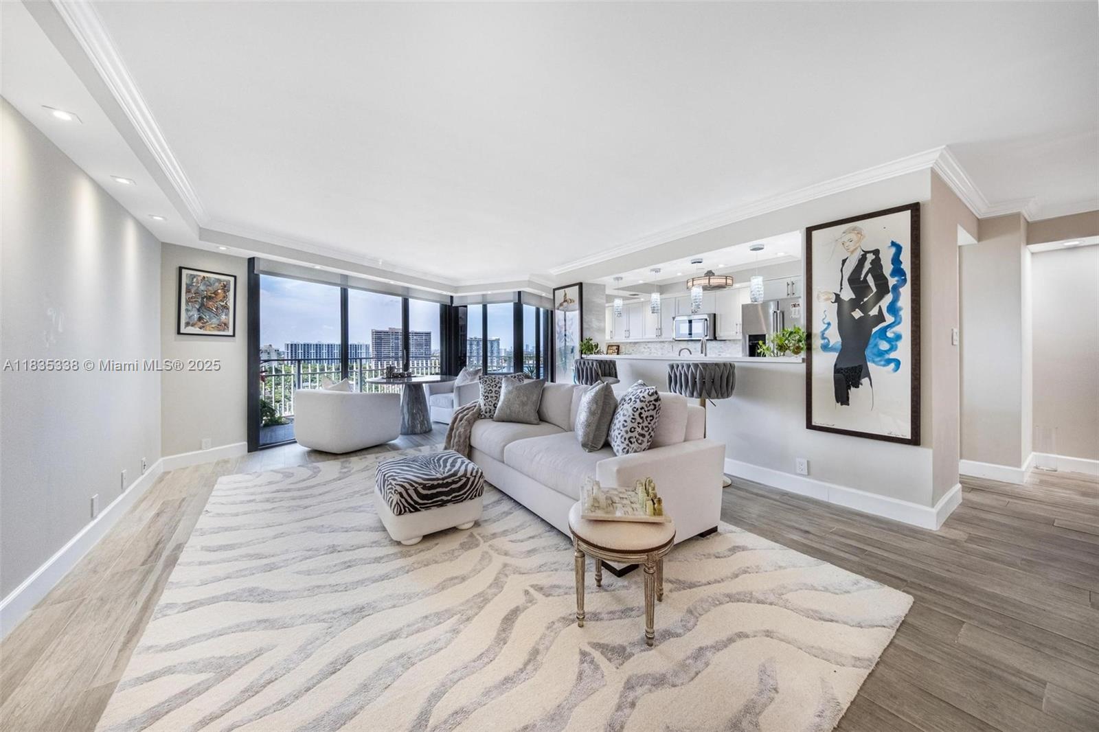 4000 Towerside Terrace, Unit 1507 Miami, FL 33138 - Photo 2 of 86 a living room with furniture and a wooden floor