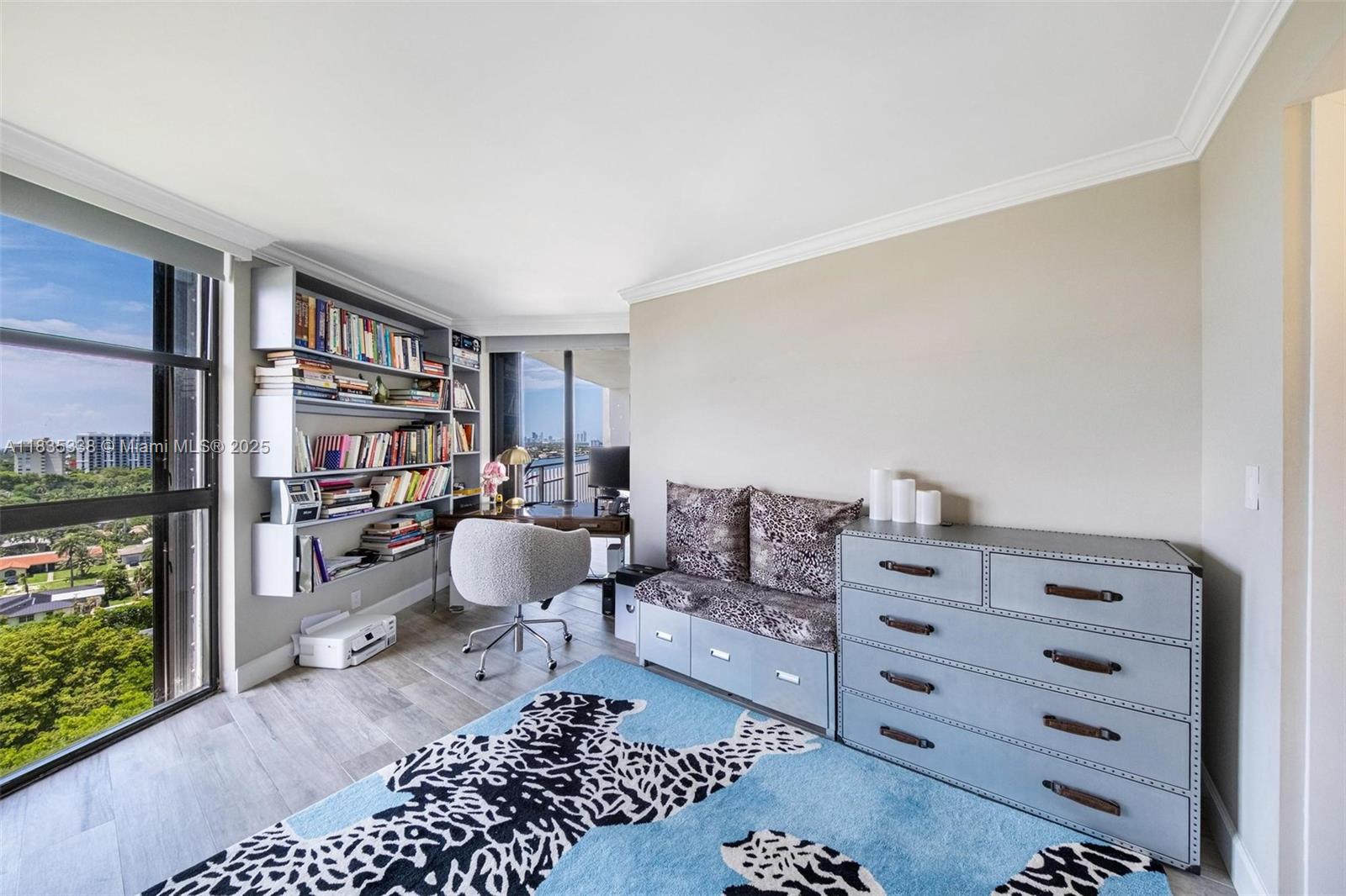 4000 Towerside Terrace, Unit 1507 Miami, FL 33138 - Photo 29 of 86 a living room with furniture and a bookshelf