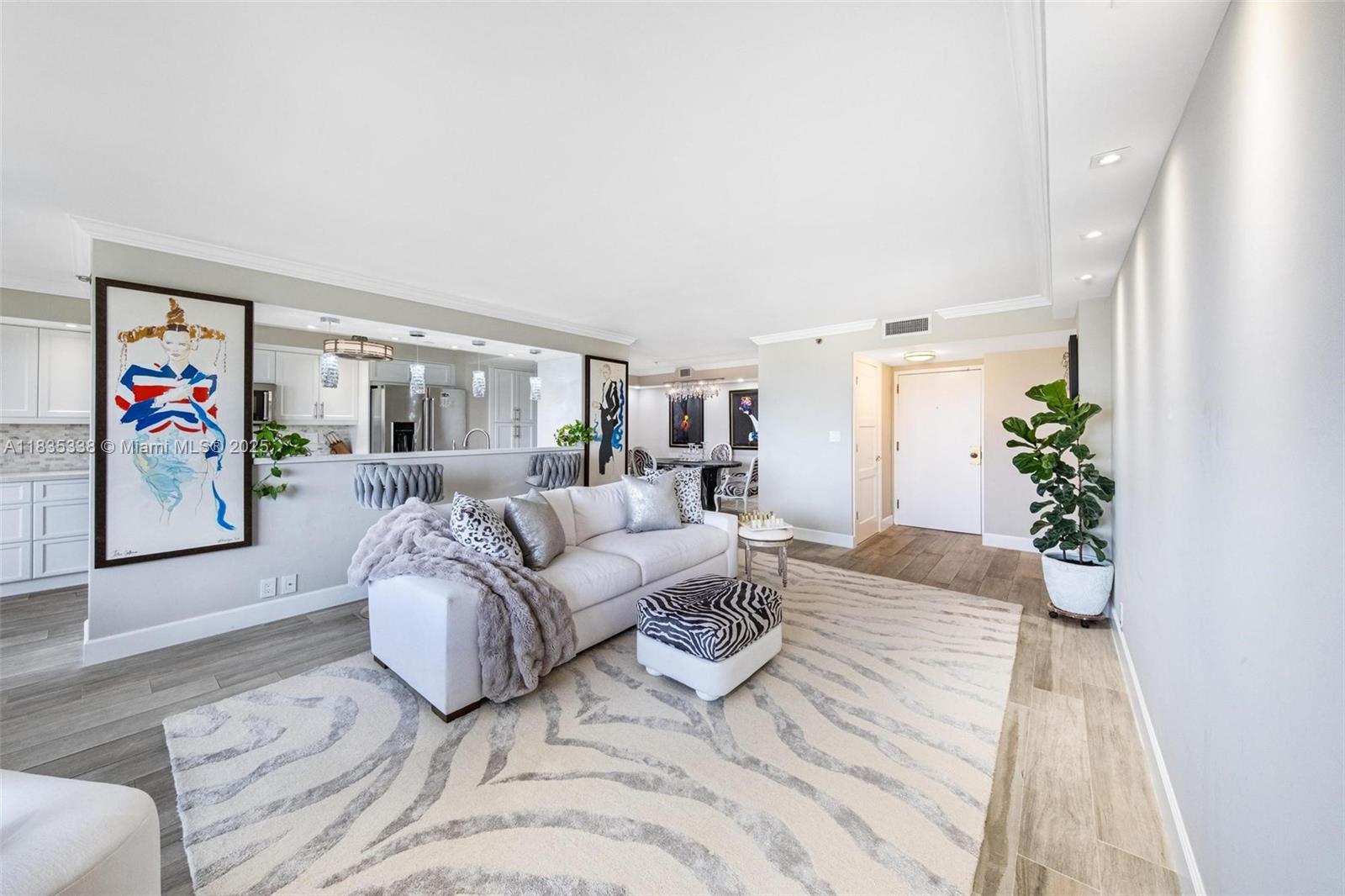 4000 Towerside Terrace, Unit 1507 Miami, FL 33138 - Photo 3 of 86 a living room with furniture and a potted plant