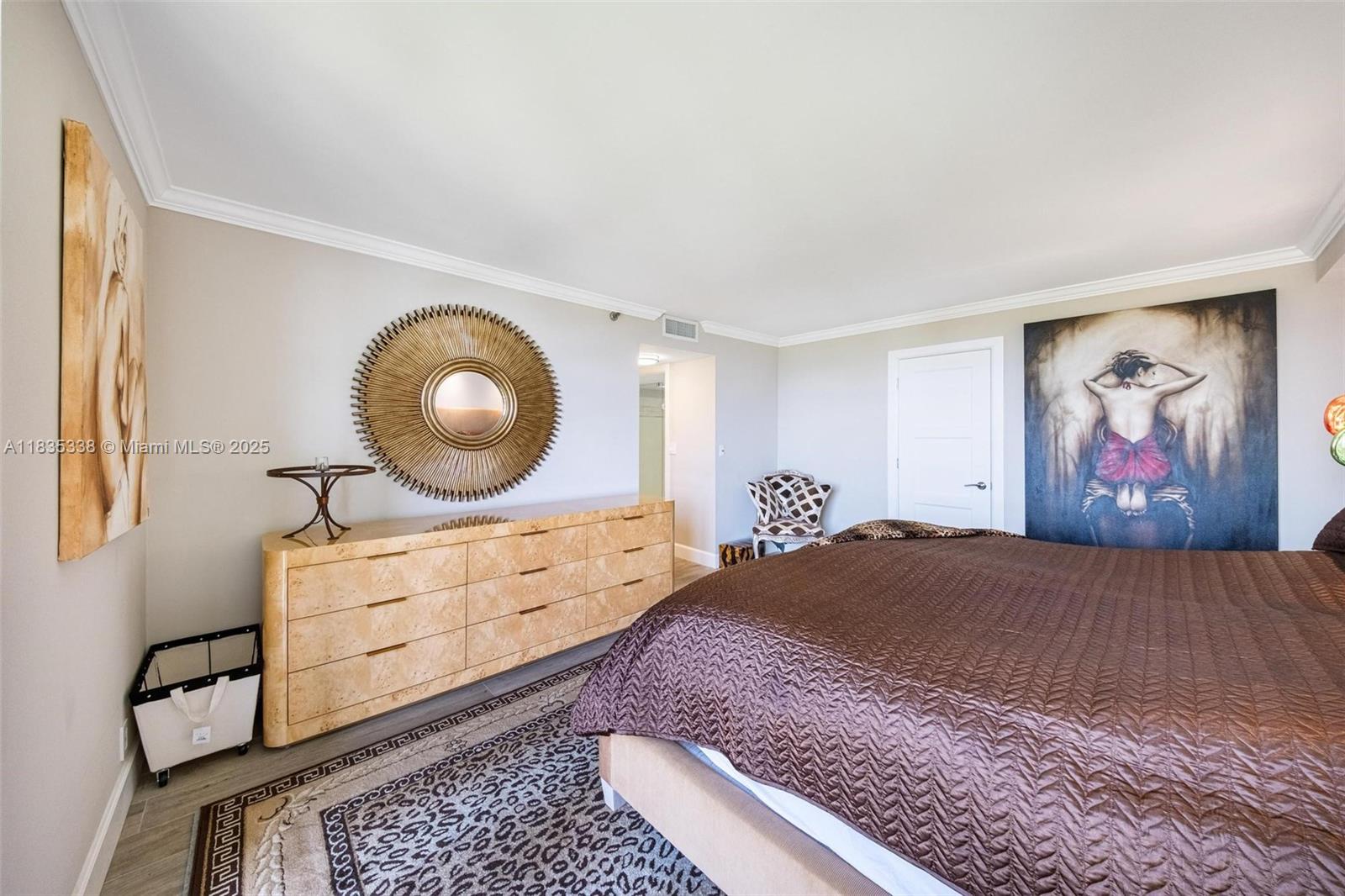 4000 Towerside Terrace, Unit 1507 Miami, FL 33138 - Photo 37 of 86 a bedroom with a bed and painting on the wall