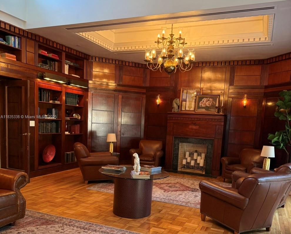 4000 Towerside Terrace, Unit 1507 Miami, FL 33138 - Photo 68 of 86 a living room with furniture a lamp and a fireplace