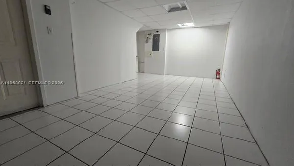 a view of an empty room and storage