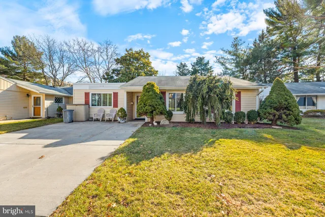 a view of a house with swimming pool and a yard
