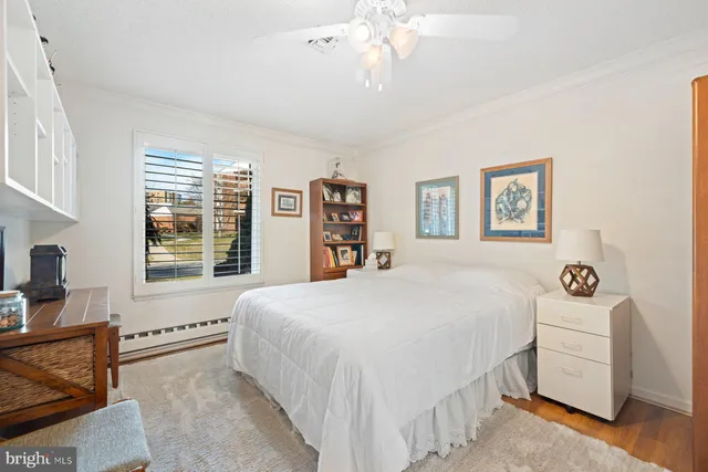 a spacious bedroom with a bed and a couch