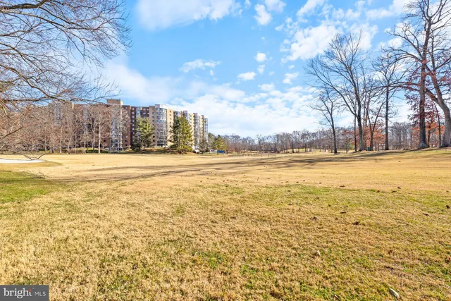 a view of an ocean with a building in the background
