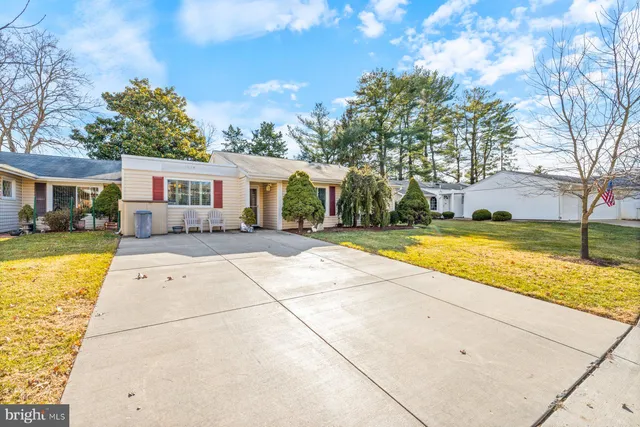 a view of house with swimming pool outdoor seating