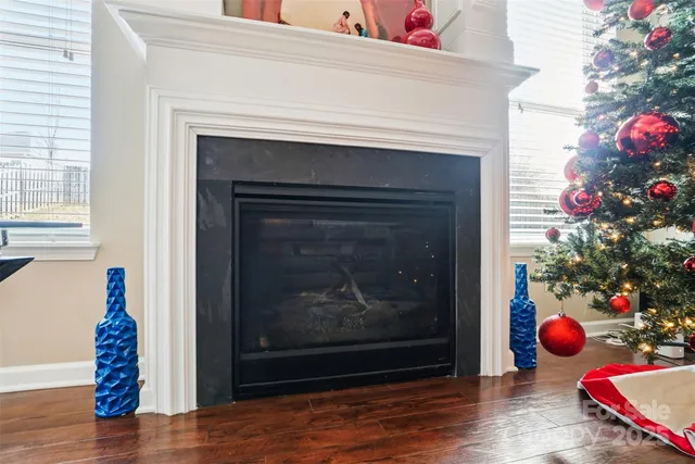 a view of a room that has a fireplace