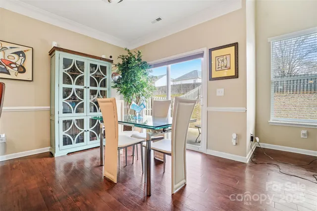 a view of a livingroom with furniture and wooden floor
