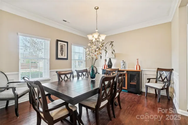 a view of a dining room with furniture and window