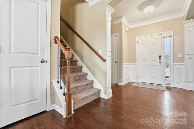a view of entryway with wooden floor
