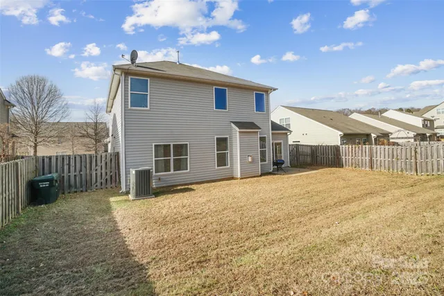 a house view with a backyard space