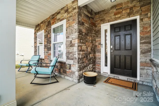 a view of an outdoor space with porch and patio