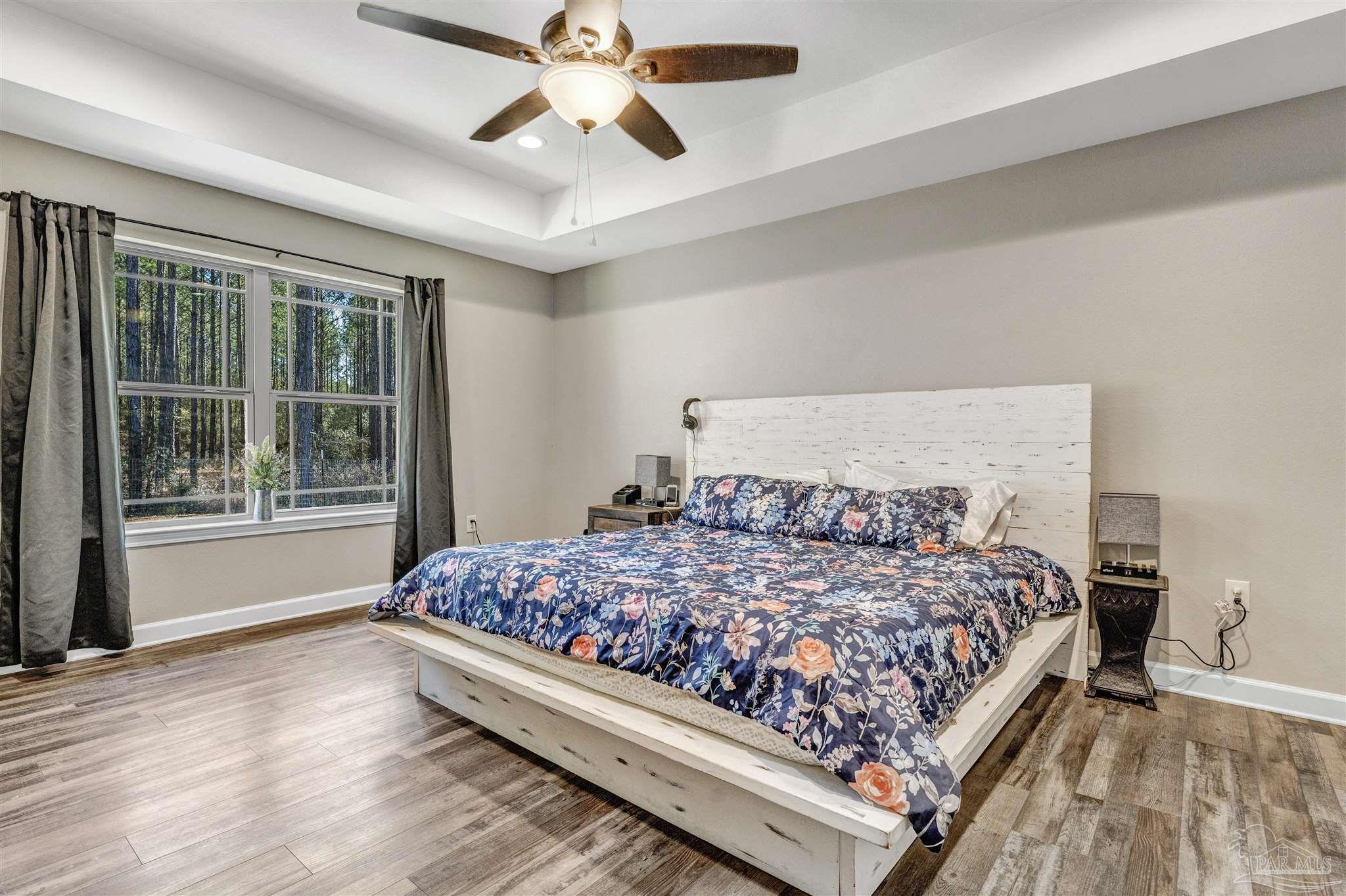 2548 10 Mile Road Milton, FL 32571 - Photo 18 of 37 a bedroom with a large bed and a window