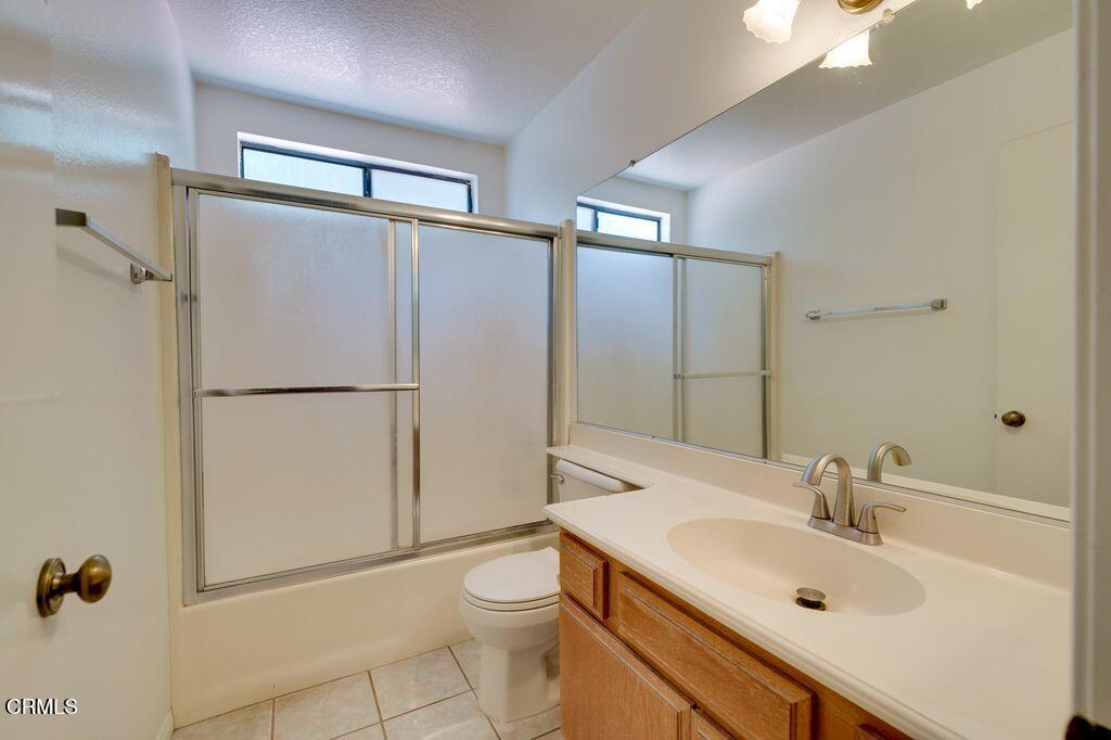8541 Creekside Place Rancho Cucamonga, CA 91730 - Photo 16 of 18 a bathroom with a sink toilet and shower