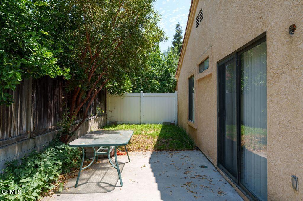 8541 Creekside Place Rancho Cucamonga, CA 91730 - Photo 17 of 18 a backyard of a house with table and chairs