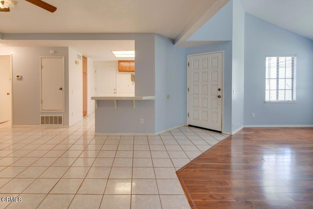 8541 Creekside Place Rancho Cucamonga, CA 91730 - Photo 8 of 18 an empty room with wooden floor and windows