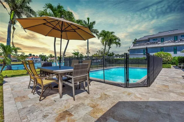 a view of a backyard with sitting area