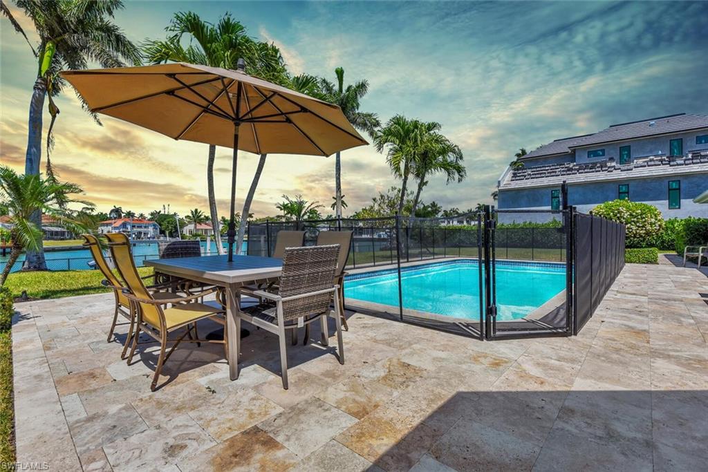367 Mooring Line Drive Naples, FL 34102 - Photo 2 of 44 a view of a backyard with sitting area