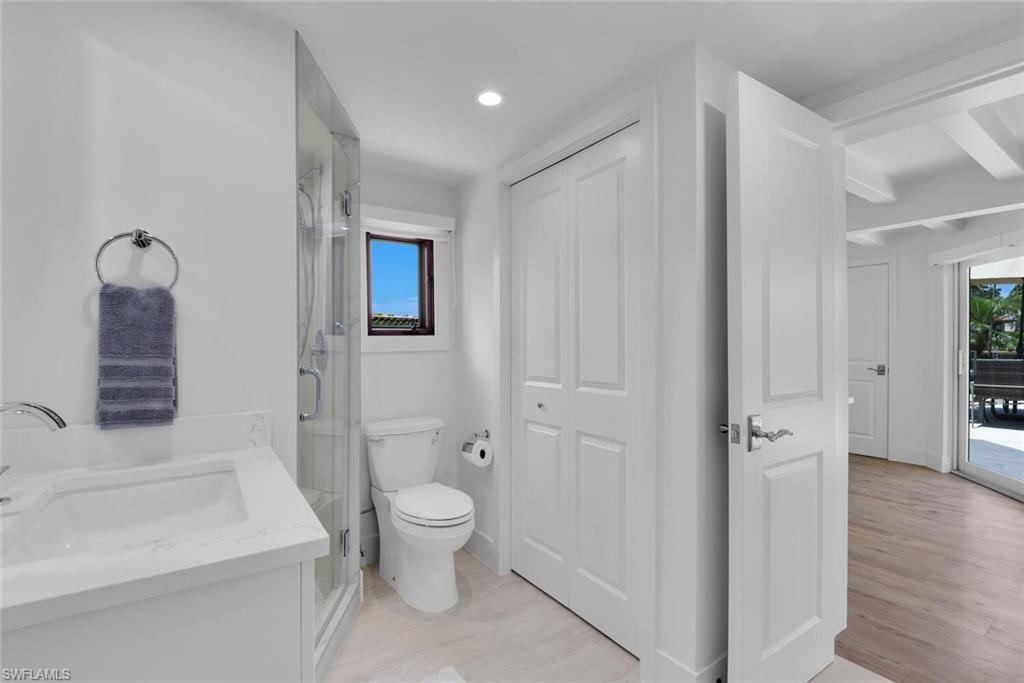 367 Mooring Line Drive Naples, FL 34102 - Photo 26 of 44 a bathroom with a sink a toilet and shower