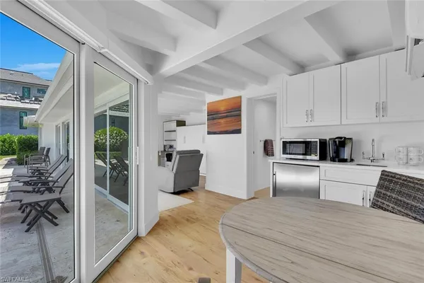 a kitchen with stainless steel appliances a refrigerator and a stove top oven