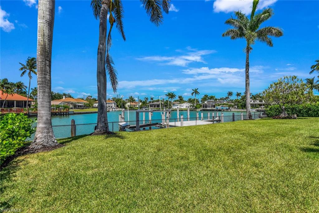 367 Mooring Line Drive Naples, FL 34102 - Photo 36 of 44 a view of a garden with a building