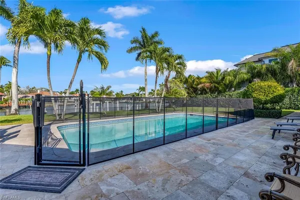 a view of outdoor space with iron fence