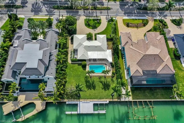 an aerial view of house with yard swimming pool and outdoor seating