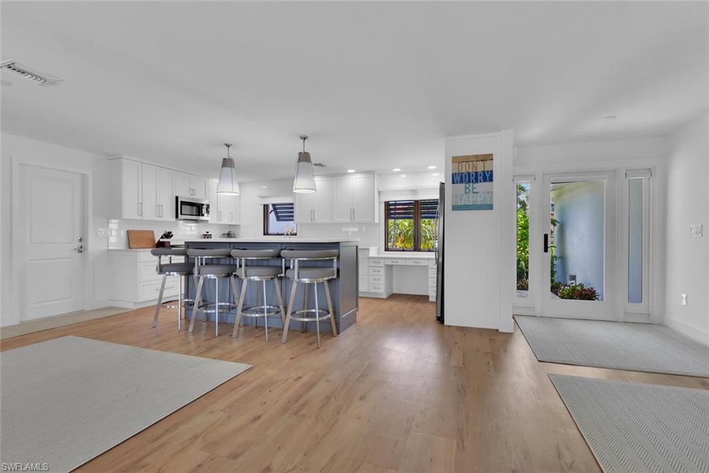 367 Mooring Line Drive Naples, FL 34102 - Photo 7 of 44 a view of a kitchen and dining room