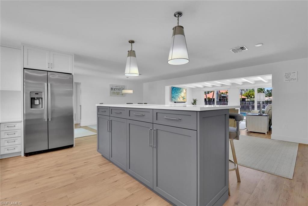 367 Mooring Line Drive Naples, FL 34102 - Photo 10 of 44 a kitchen with stainless steel appliances a sink and refrigerator