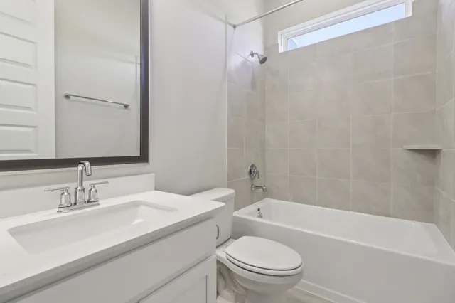 a bathroom with a sink a toilet and a bathtub