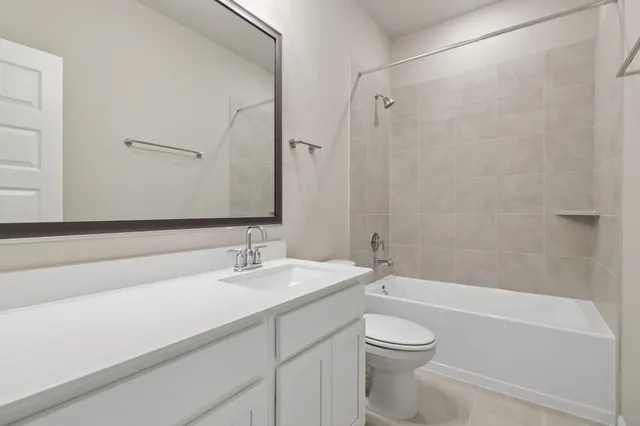 a bathroom with a sink a toilet and a bathtub