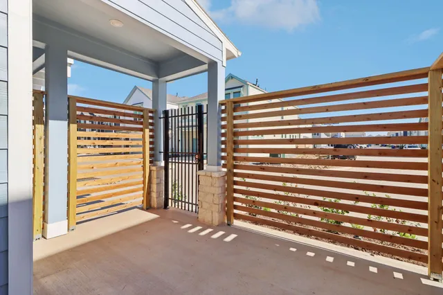 a view of walk in closet with clothes