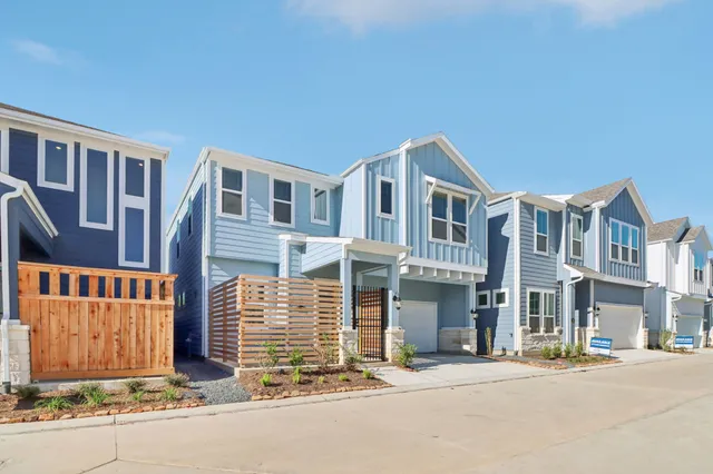 front view of a brick house with a street