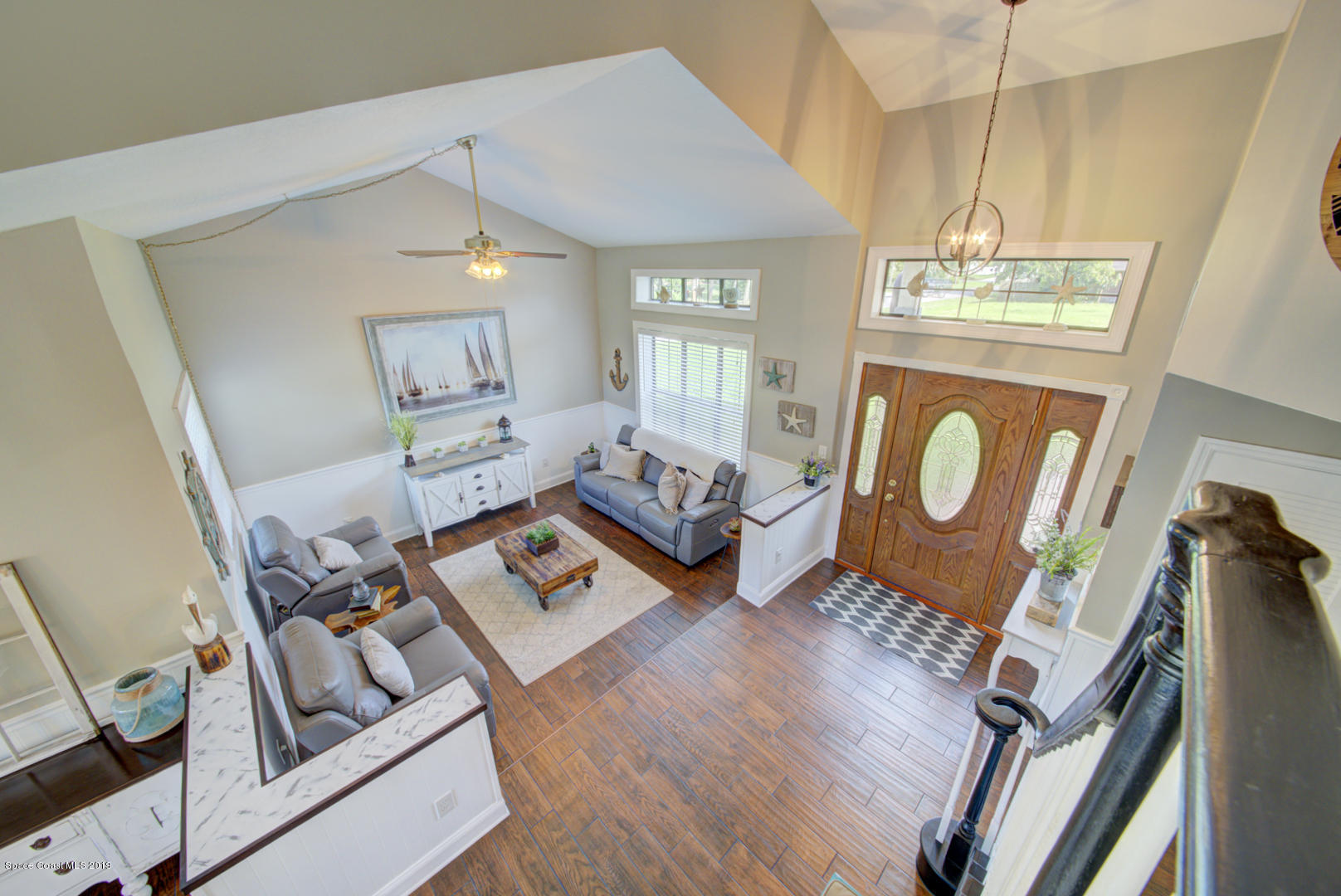 6300 Janina Road Cocoa, FL 32927 - Photo 52 of 74 view of living room & foyer from stairs