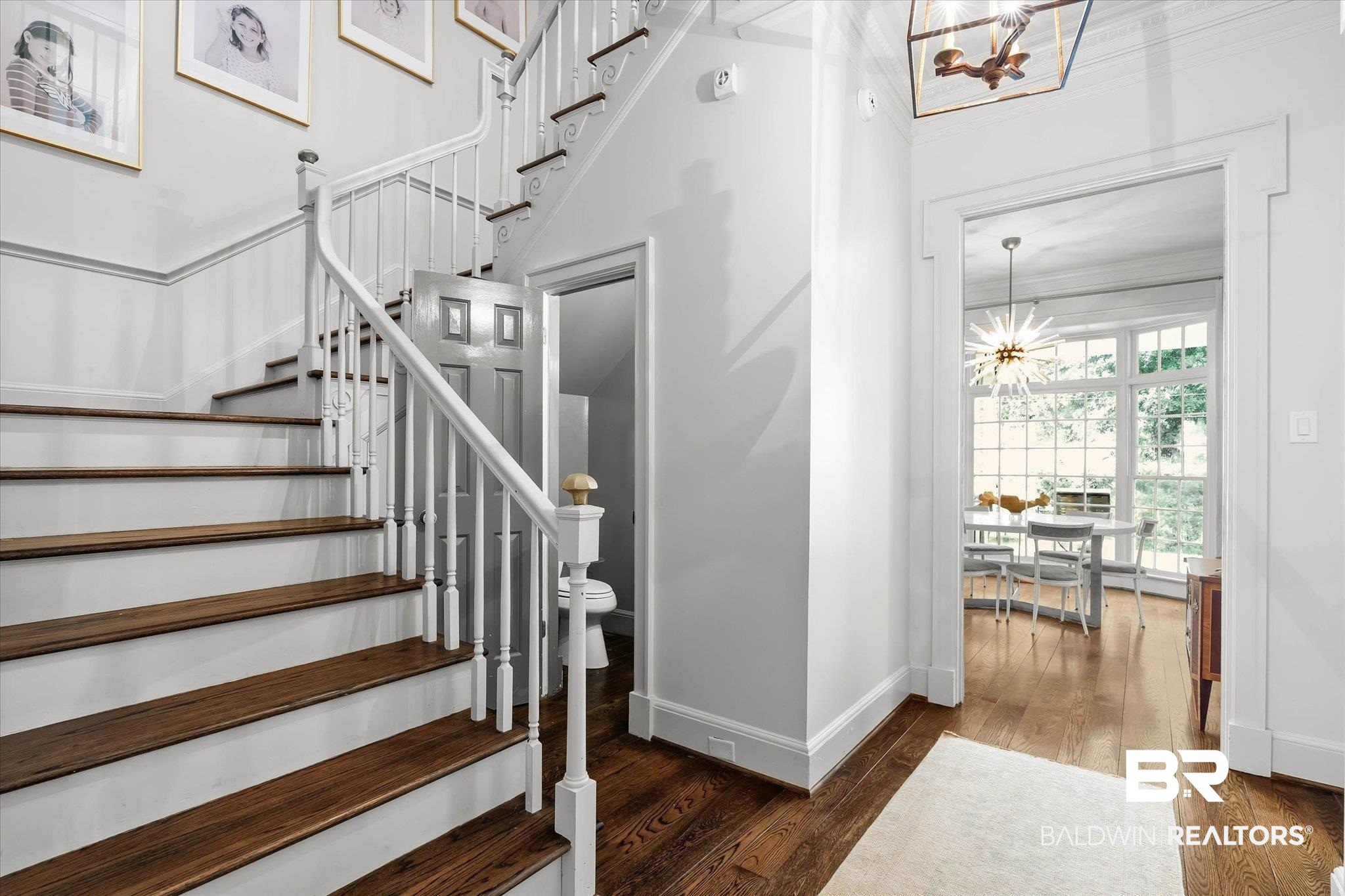 3908 Yester Place Mobile, AL 36608 - Photo 25 of 45 Hardwood stairs with white balusters and handrail