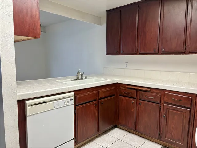 a kitchen with sink and cabinets