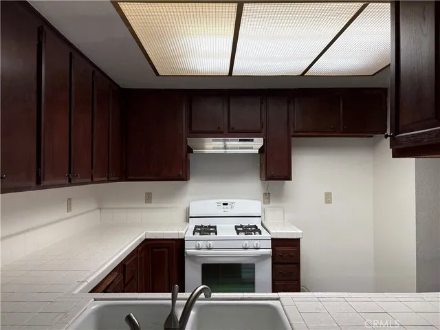 a kitchen with a stove and a microwave
